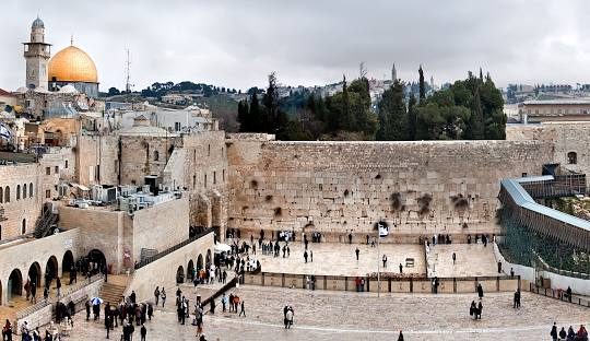 Jerusalem's Western Wall with golden dome visible